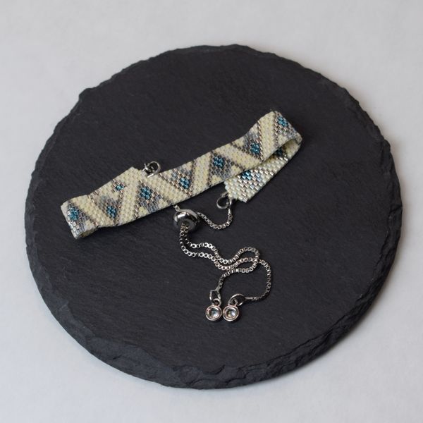Blue-beige bracelet with palladium corners