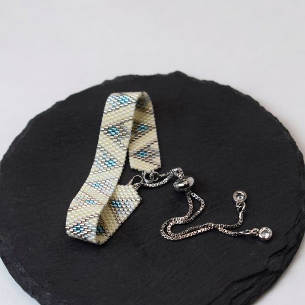 Blue-beige bracelet with palladium corners