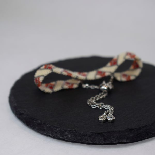 Red-beige bracelet with palladium corners