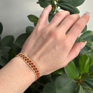 Red flower bracelet with gold