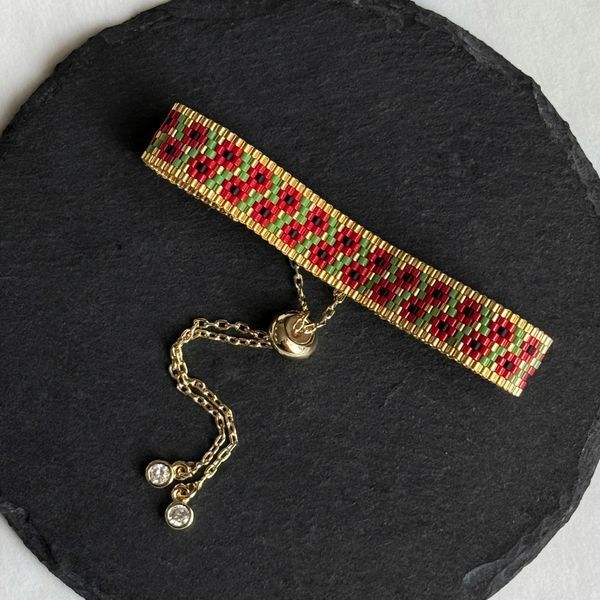 Red flower bracelet with gold