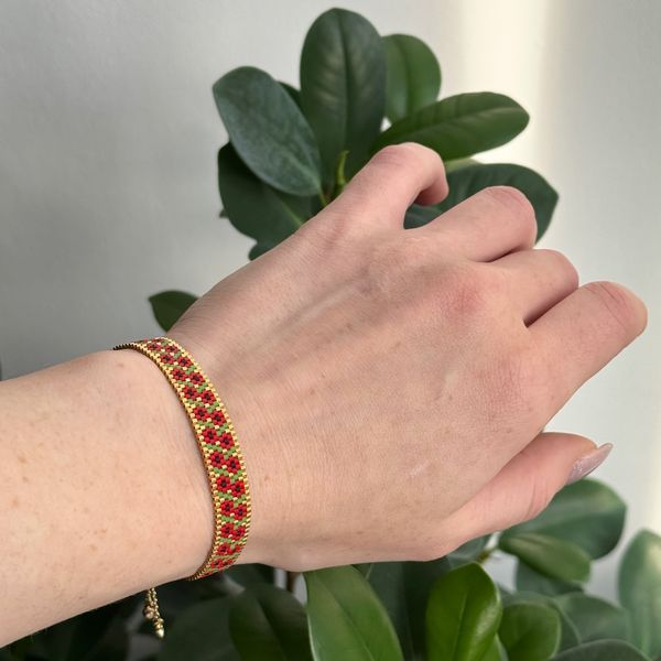 Red flower bracelet with gold