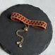 Red flower bracelet with gold