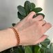 Red flower bracelet with gold